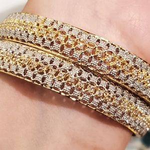 Gold plates two tones bangles in Ad stones.